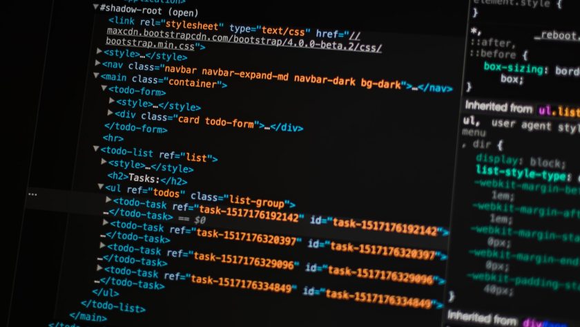 turned on monitor displaying programming language
